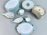 many plates and bowls that are sitting on a table