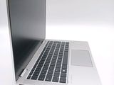 a close up of a laptop computer on a white surface