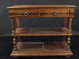 a wooden table with two shelves on top of it