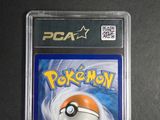 the pokemon card is in a plastic holder on a table