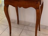 a small table with a lamp on top of it