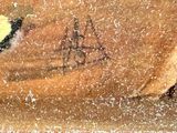a painting of a bird sitting on a wooden table