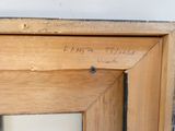 a close up of a wooden frame with writing on it