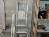 a ladder that is leaning against a wall in a room