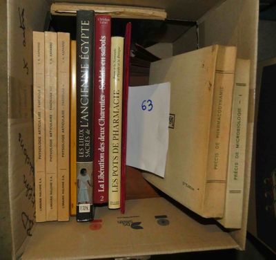 many books in a box on a table