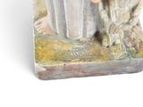 a figurine of a woman holding a bucket of flowers