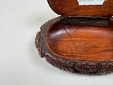 a small wooden box with a label on it