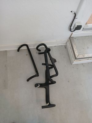 a bike rack that is on the floor next to a toilet