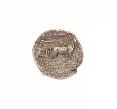 gros plan d'une pièce de monnaie sur laquelle figure un cheval