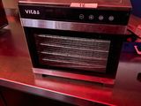 a microwave that is sitting on a red counter