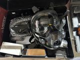 a box with a gas mask and other items in it