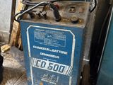 a small blue machine that is sitting on the ground