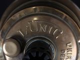 a close up of a metal object with the word dunkin on it