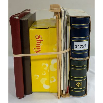 several books are stacked on top of each other on a table