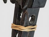 a close up of a metal object with a rope around it