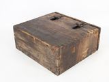 a small wooden box with a latch on it
