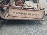 a tractor that is parked in a lot with a sign on it