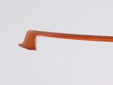 a close up of a wooden handle on a pair of glasses