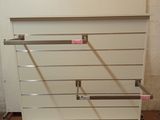 a white shelf that has a bunch of shelves on it