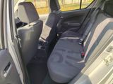 the back seats of a car with a seat belt in the back of it