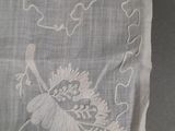 a piece of cloth with a design on it on a table