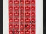 a red and white picture of a stamp with a signature on it