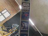 a picture of a sign in a gym with a lot of equipment