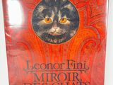 the cover of a book with a cat ' s face on it