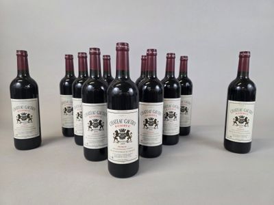 six bottles of wine are lined up in a row on a table