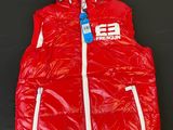 a red vest with a white hood and a blue tag on it