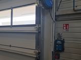 an image of a garage door with a window open