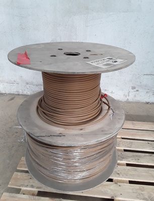 a spool of wire on a pallet with a red piece of tape