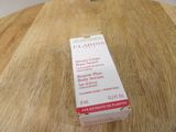 a close up of a box of cream on a wooden table