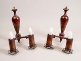 pair of red and gold vases with white candles on them