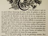 an old book with a drawing of a crescent and flowers on it