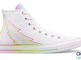 a pair of white high top sneakers with rainbows on them