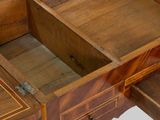 a wooden dressing table with a mirror on it