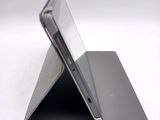 a close up picture of a tablet computer on a stand