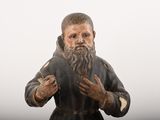 a figurine of a man with a long beard