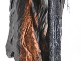 an image of a black and copper dress on a mannequin