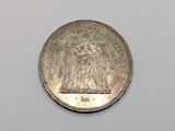 an image of a coin on a white surface