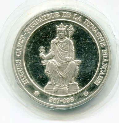une image représentant une pièce d'argent sur laquelle figure une femme assise sur un trône