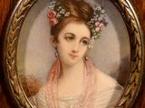 portrait of a woman in a pink dress with a wreath of flowers in her hair