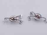 a pair of silver plated earrings with a knot on the end