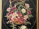 an image of a picture of a basket of flowers on a wall
