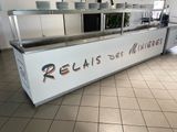 a picture of a restaurant kitchen with a large counter