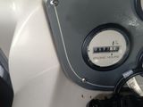 a close up view of a motorcycle ' s dashboard with the gauges on
