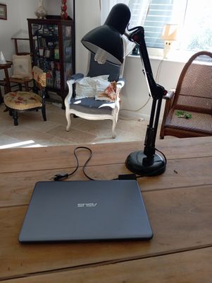 a laptop sitting on a table in a living room
