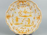 a yellow and white plate with a design of people on it