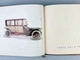 an open book with a picture of an old car on it